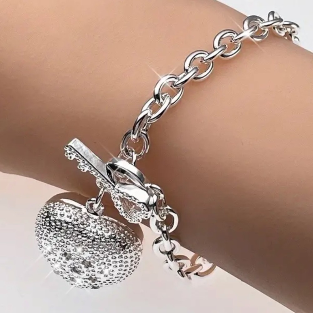 NWT 925 Sterling Silvery Plated Bracelet with Purple Heart Pendant.